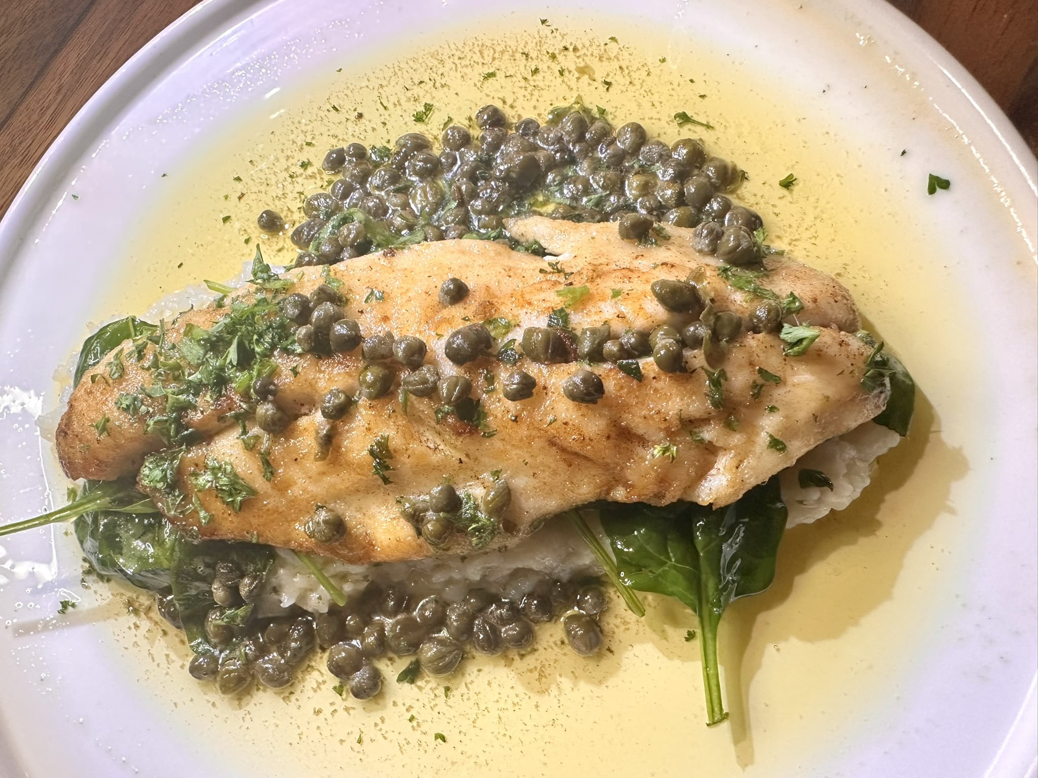 Above and below, the Branzino Meuniere at Chapeau in SF