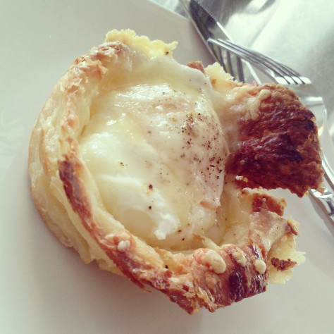 Fresh croissant with over easy
