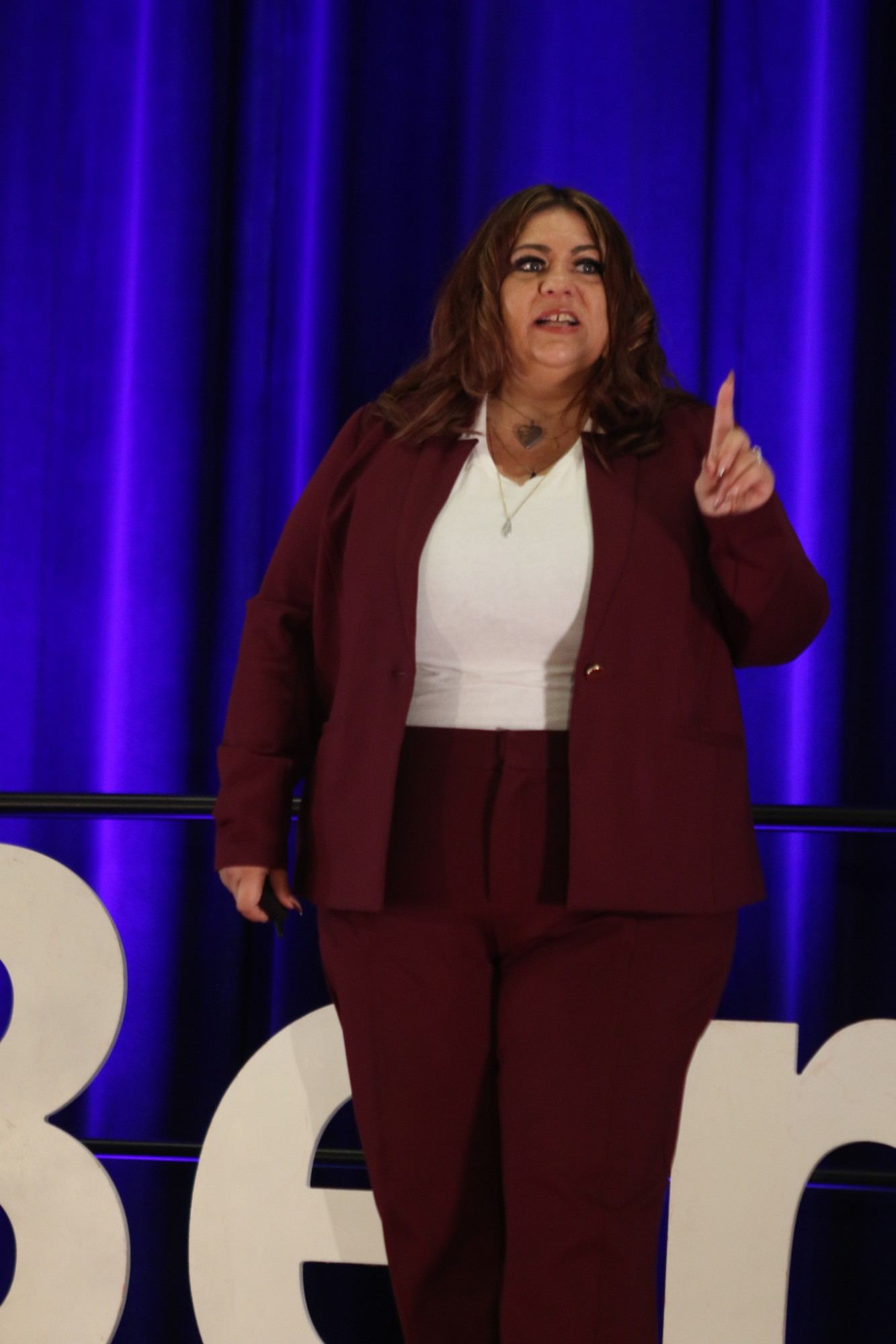 Alicia Baker making a point on stage at TEDxBerkeley 2026